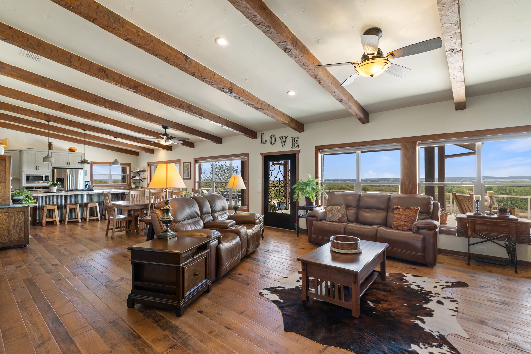 546 Lazy Oak Road Hye, TX 78635 - Photo 18 of 34 Living area with a ceiling fan, hardwood / wood-style floors, recessed lighting, and beam ceiling