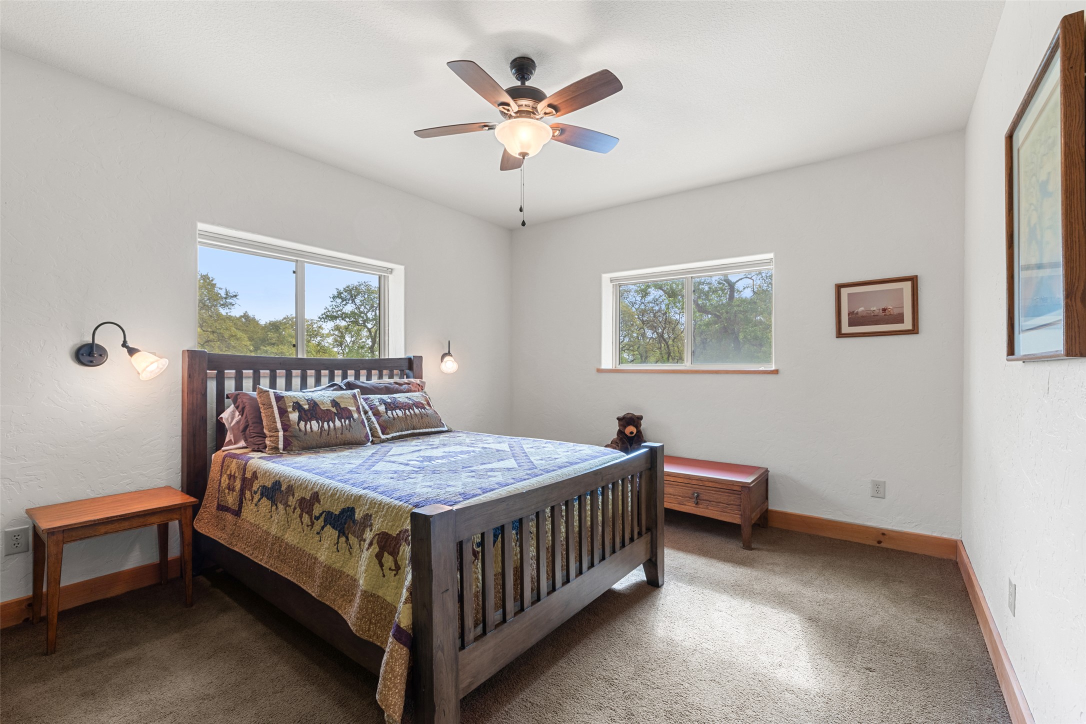 546 Lazy Oak Road Hye, TX 78635 - Photo 29 of 34 Carpeted bedroom featuring baseboards and a ceiling fan