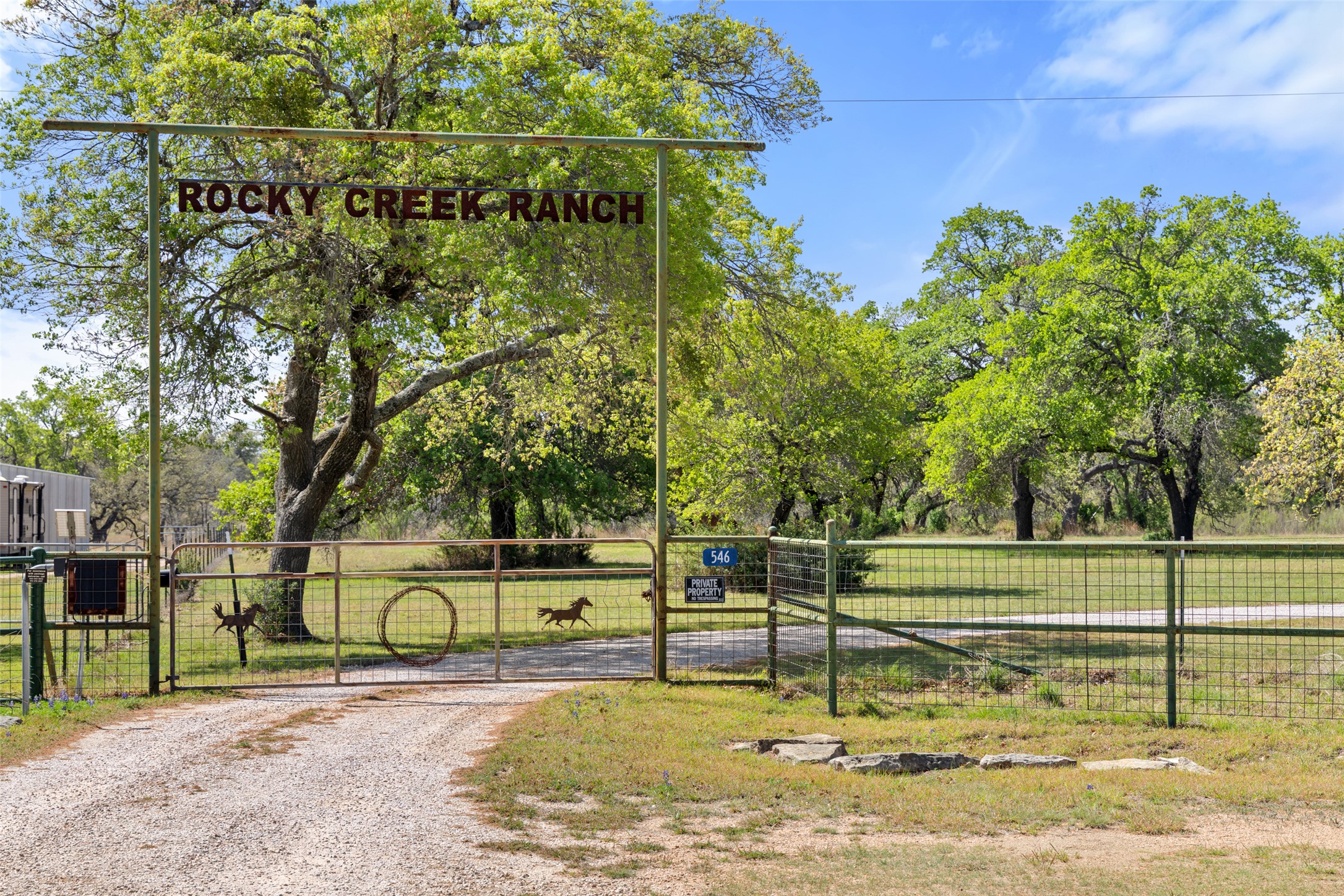 546 Lazy Oak Road Hye, TX 78635 - Photo 4 of 34 View of street with a gate, a gated entry, and view of scattered trees