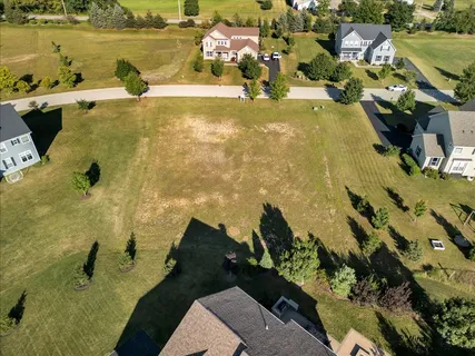 a view of a swimming pool with a yard
