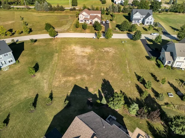 a view of a swimming pool with a yard