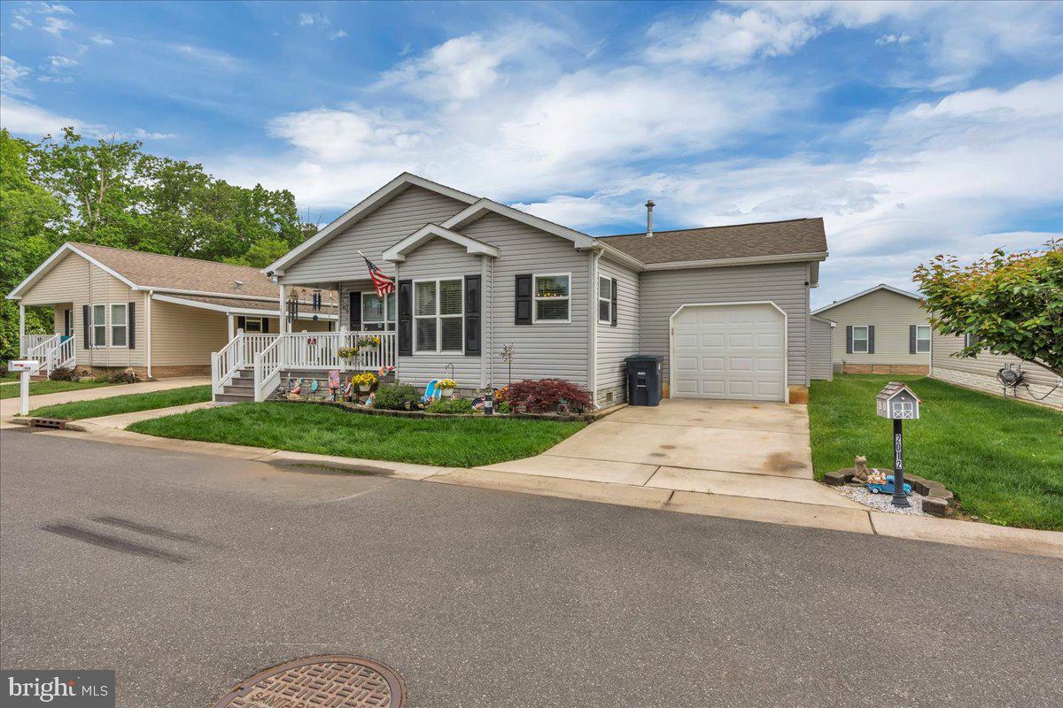 2012 Ocean Lane Williamstown, NJ 08094 - Photo 1 of 31 a front view of a house with a yard and garage