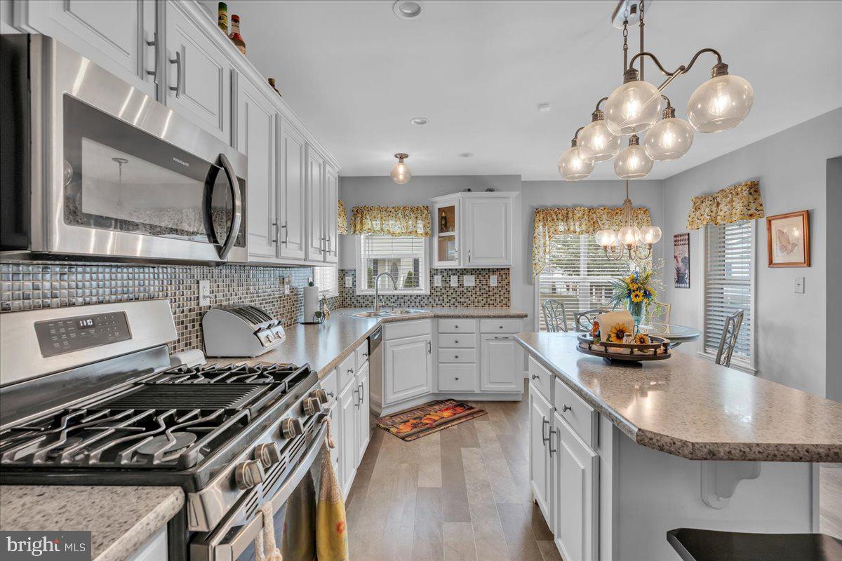 2012 Ocean Lane Williamstown, NJ 08094 - Photo 11 of 31 a kitchen with stainless steel appliances a sink a stove and cabinets