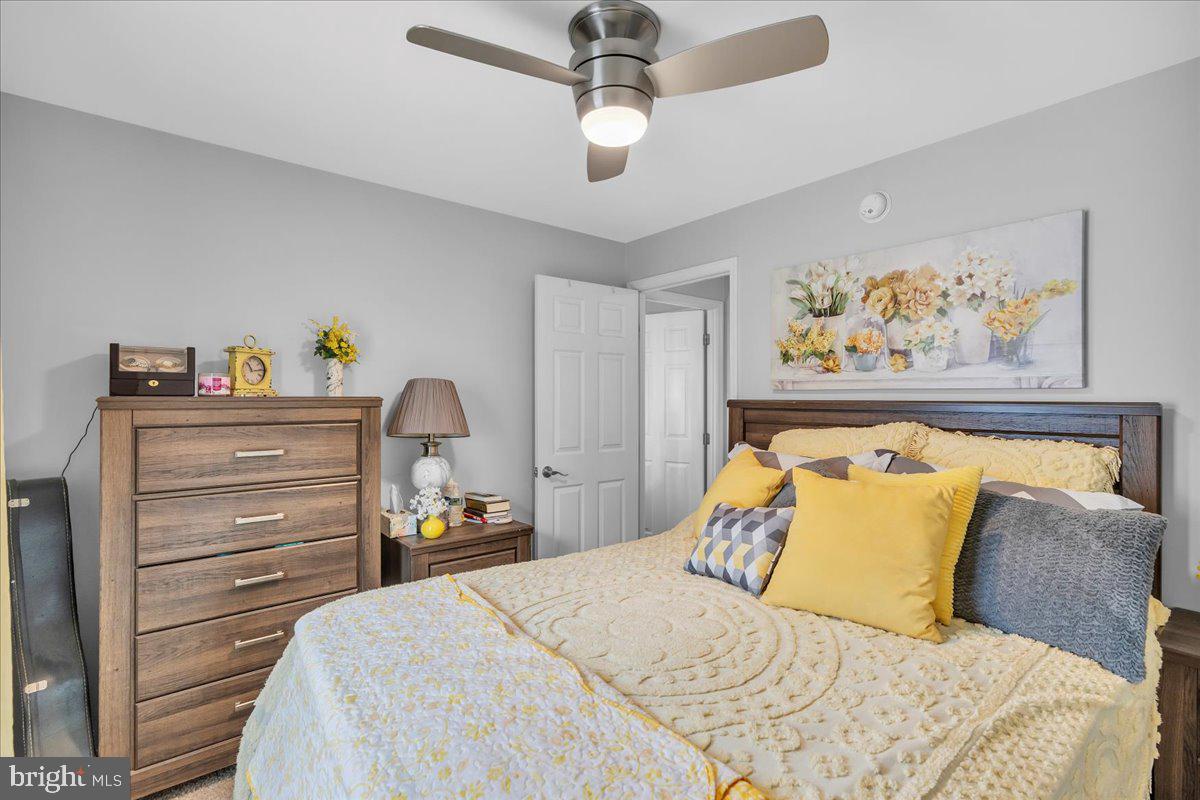 2012 Ocean Lane Williamstown, NJ 08094 - Photo 18 of 31 a bedroom with a bed and ceiling fan