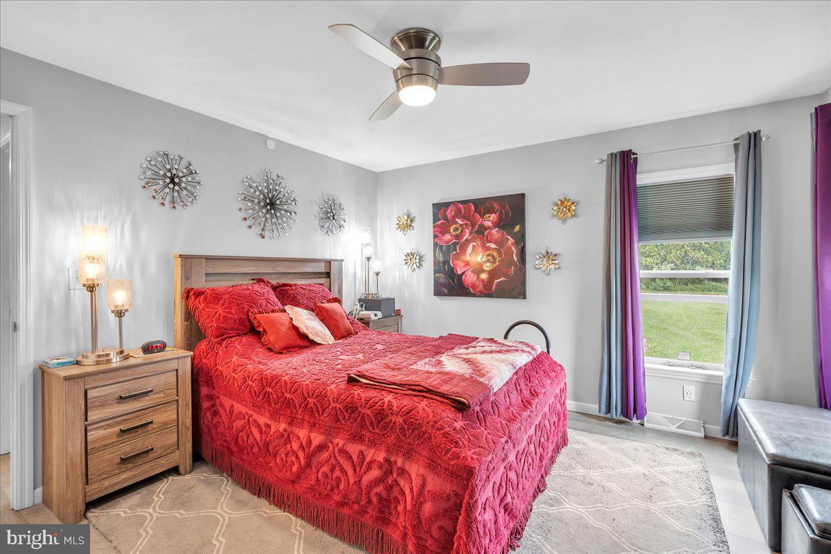2012 Ocean Lane Williamstown, NJ 08094 - Photo 19 of 31 a bedroom with a bed and a chandelier