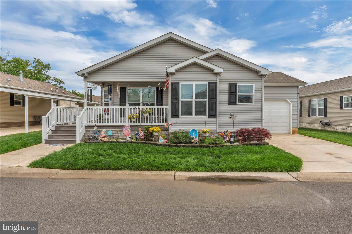 2012 Ocean Lane Williamstown, NJ 08094 - Photo 2 of 31 a front view of a house with a garden and plants