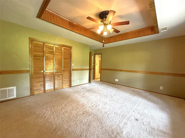 a view of a livingroom with a ceiling fan