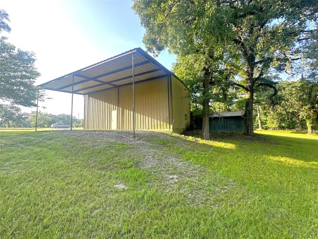a house with swimming pool in front of it
