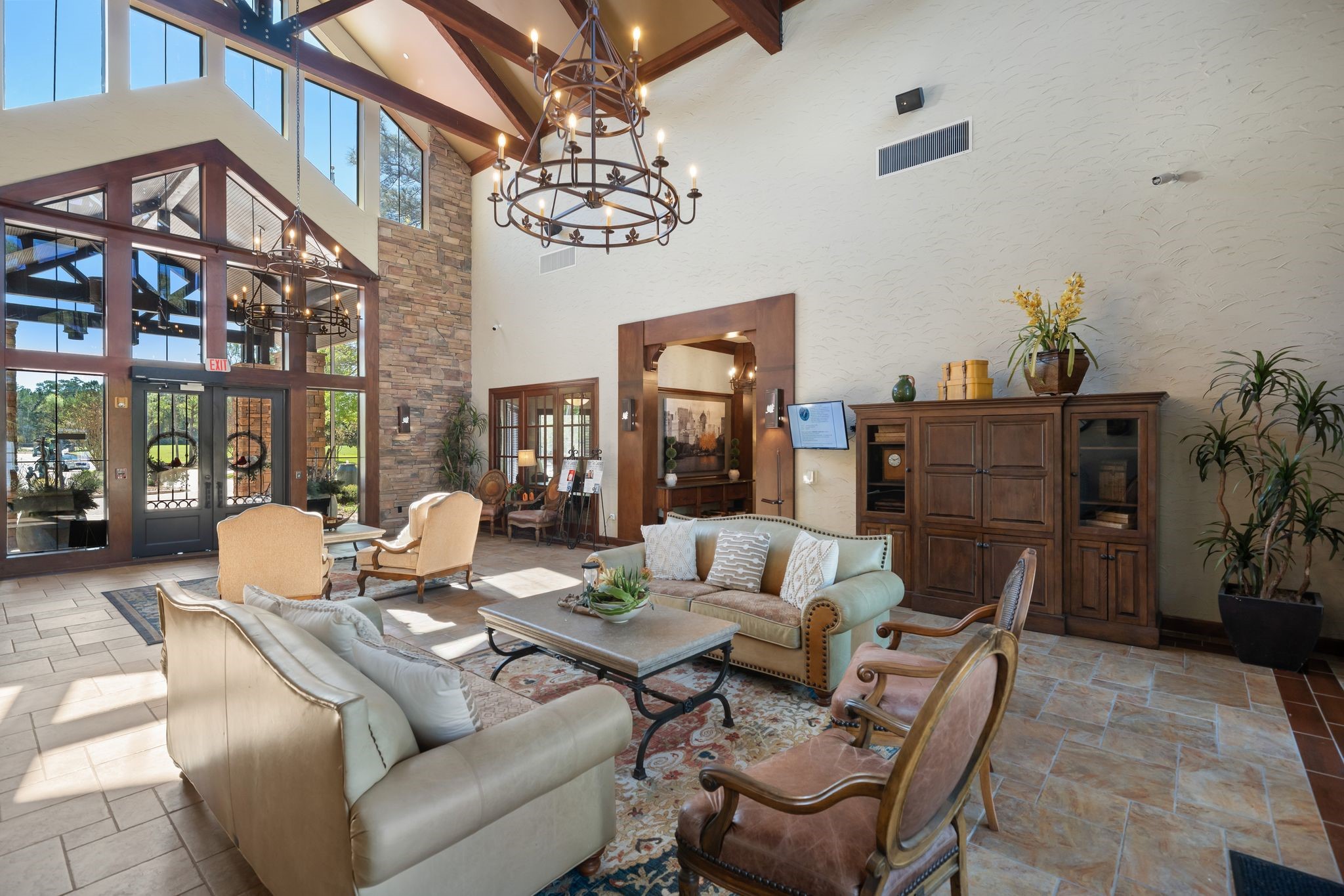 7 Sovereign Way Conroe, TX 77384 - Photo 25 of 31 a living room with furniture a chandelier and a dining table
