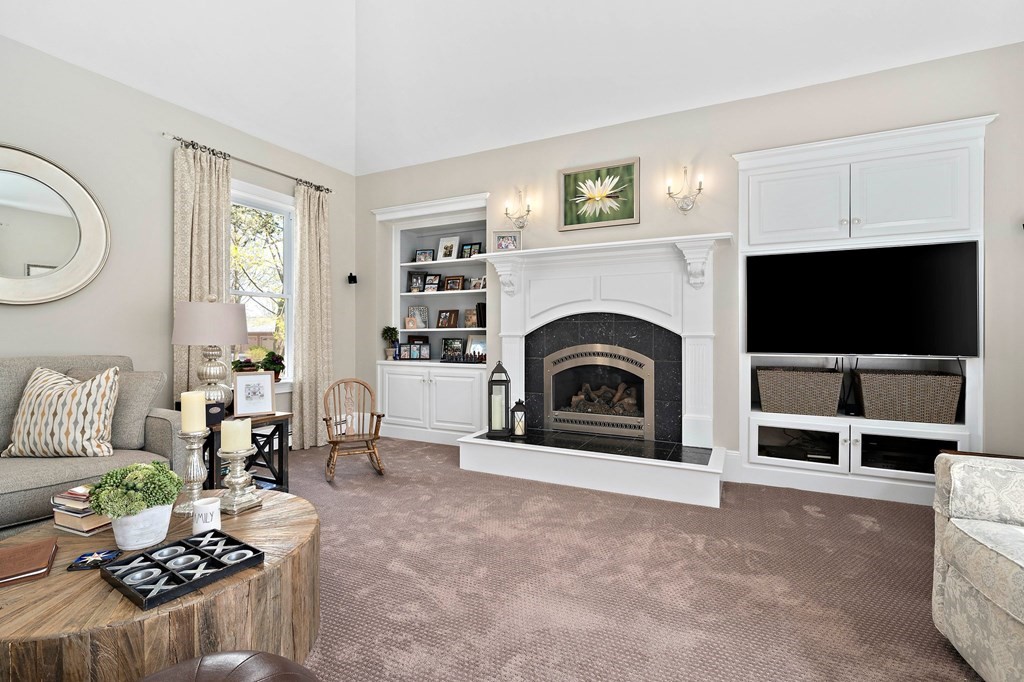 273 Wareham Street Middleboro, MA 02346 - Photo 12 of 42 a living room with furniture a fireplace and a flat screen tv