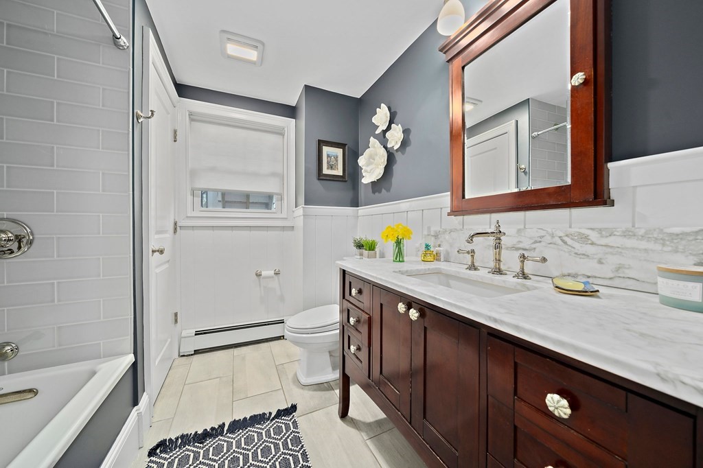 273 Wareham Street Middleboro, MA 02346 - Photo 15 of 42 a bathroom with a granite countertop sink toilet and shower