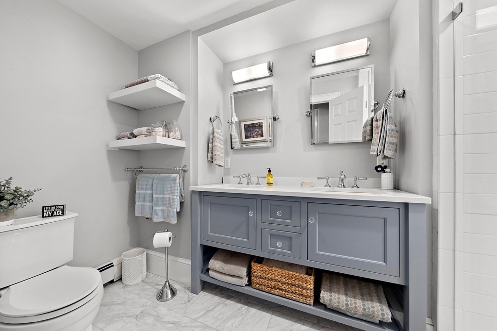 273 Wareham Street Middleboro, MA 02346 - Photo 22 of 42 a bathroom with a sink a toilet and mirror