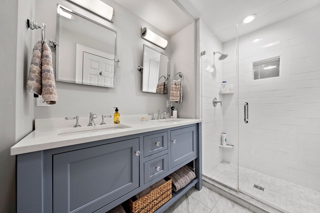 273 Wareham Street Middleboro, MA 02346 - Photo 23 of 42 a bathroom with double vanity sink a mirror and shower