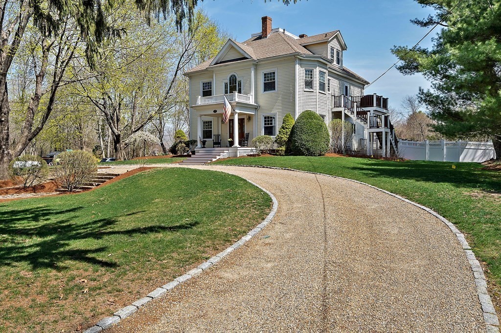273 Wareham Street Middleboro, MA 02346 - Photo 3 of 42 a view of a white house with a yard and plants