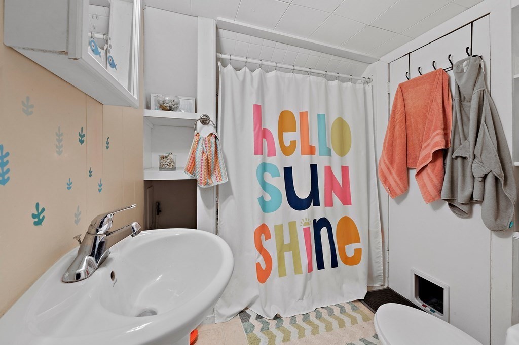 273 Wareham Street Middleboro, MA 02346 - Photo 36 of 42 a bathroom with a sink and a shower curtain