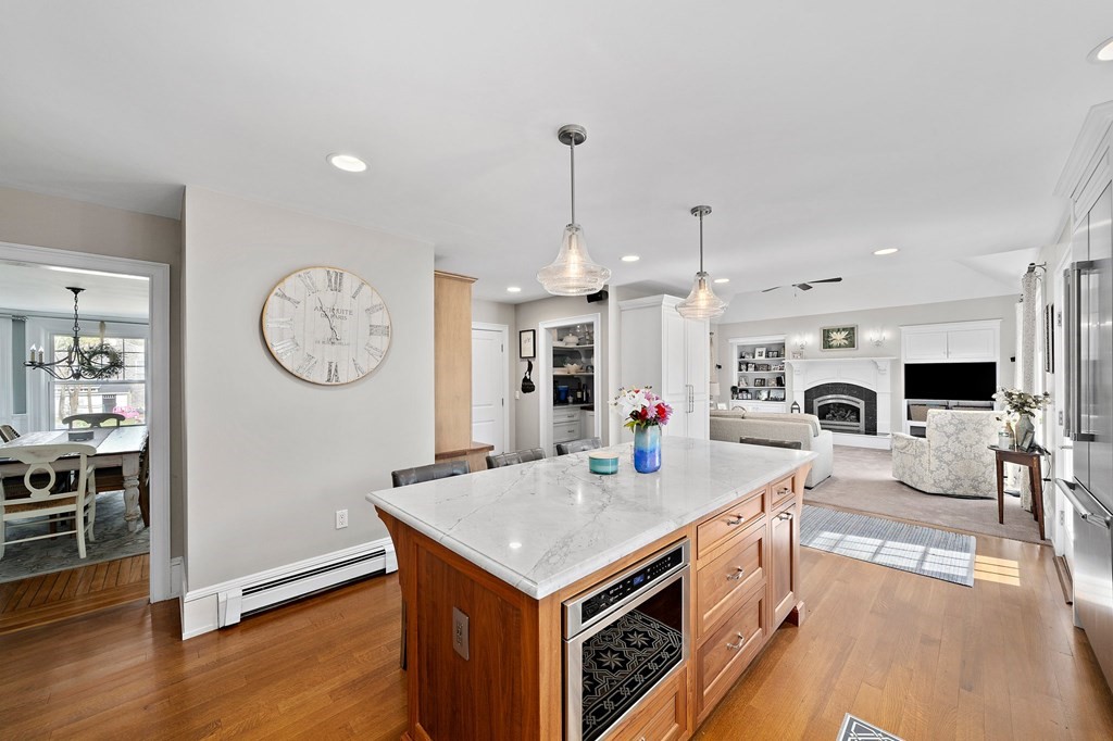 273 Wareham Street Middleboro, MA 02346 - Photo 7 of 42 a living room with furniture a clock and a view of kitchen