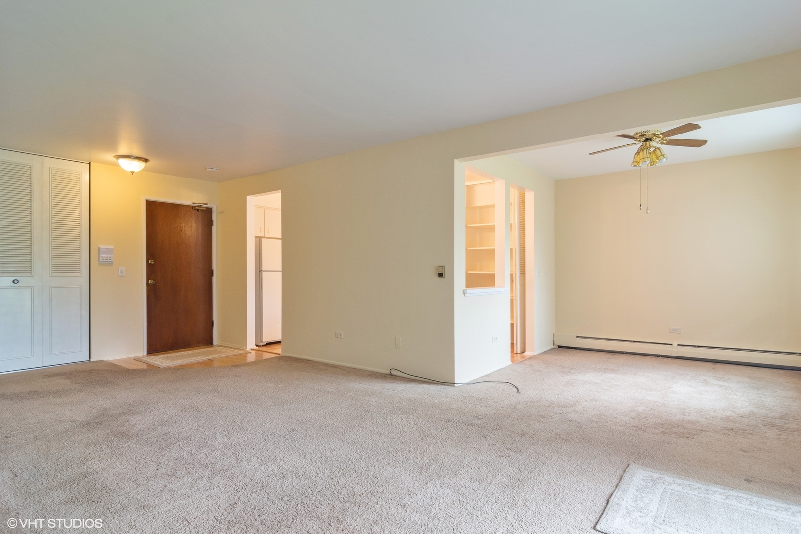 2407 East Brandenberry Court, Unit 1L Arlington Heights, IL 60004 - Photo 3 of 10 a view of an empty room with a window