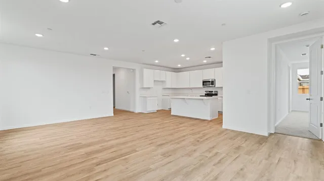 a view of kitchen with wooden floor