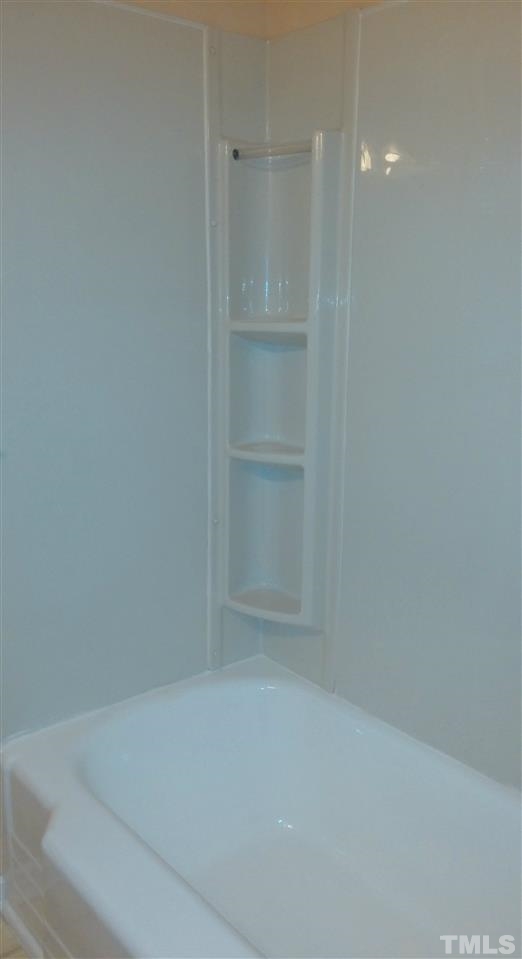 5149 Jeffries Street Raleigh, NC 27606 - Photo 8 of 22 Tub detail, shelving on each side.