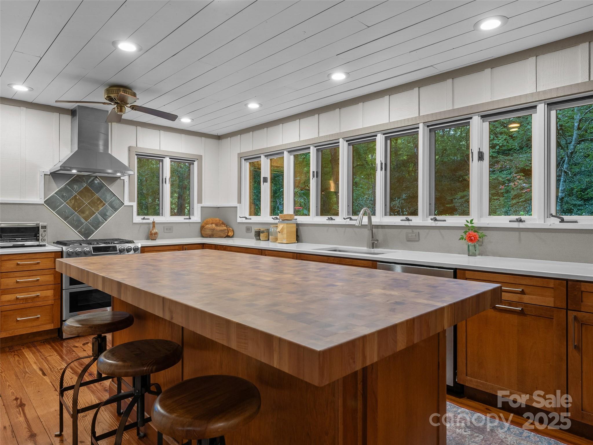 273 David's Trace Pisgah Forest, NC 28768 - Photo 13 of 48 a kitchen with a table chairs sink and cabinets