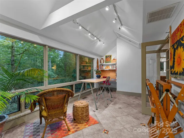 a view of a dining room with furniture window and outside view