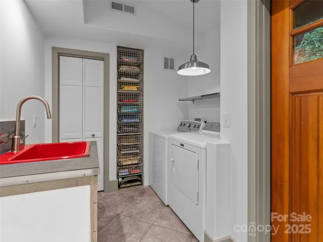 a living room filled with furniture and a floor to ceiling window