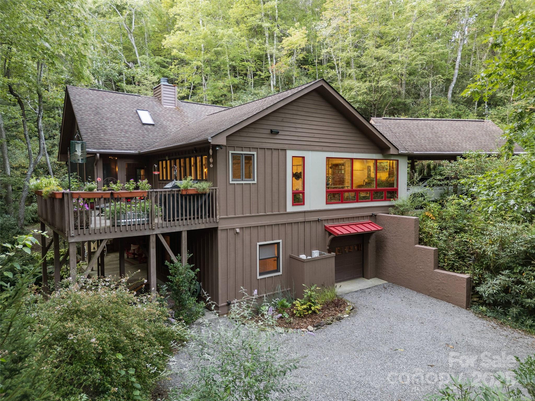 273 David's Trace Pisgah Forest, NC 28768 - Photo 3 of 48 a view of a house with brick walls and a yard