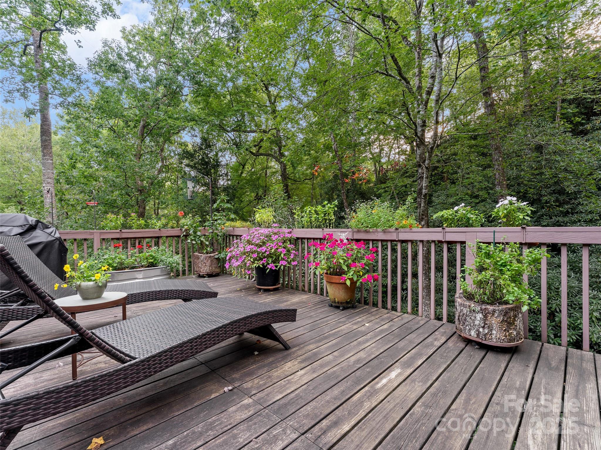 273 David's Trace Pisgah Forest, NC 28768 - Photo 34 of 48 a view of a deck with wooden floor and furniture