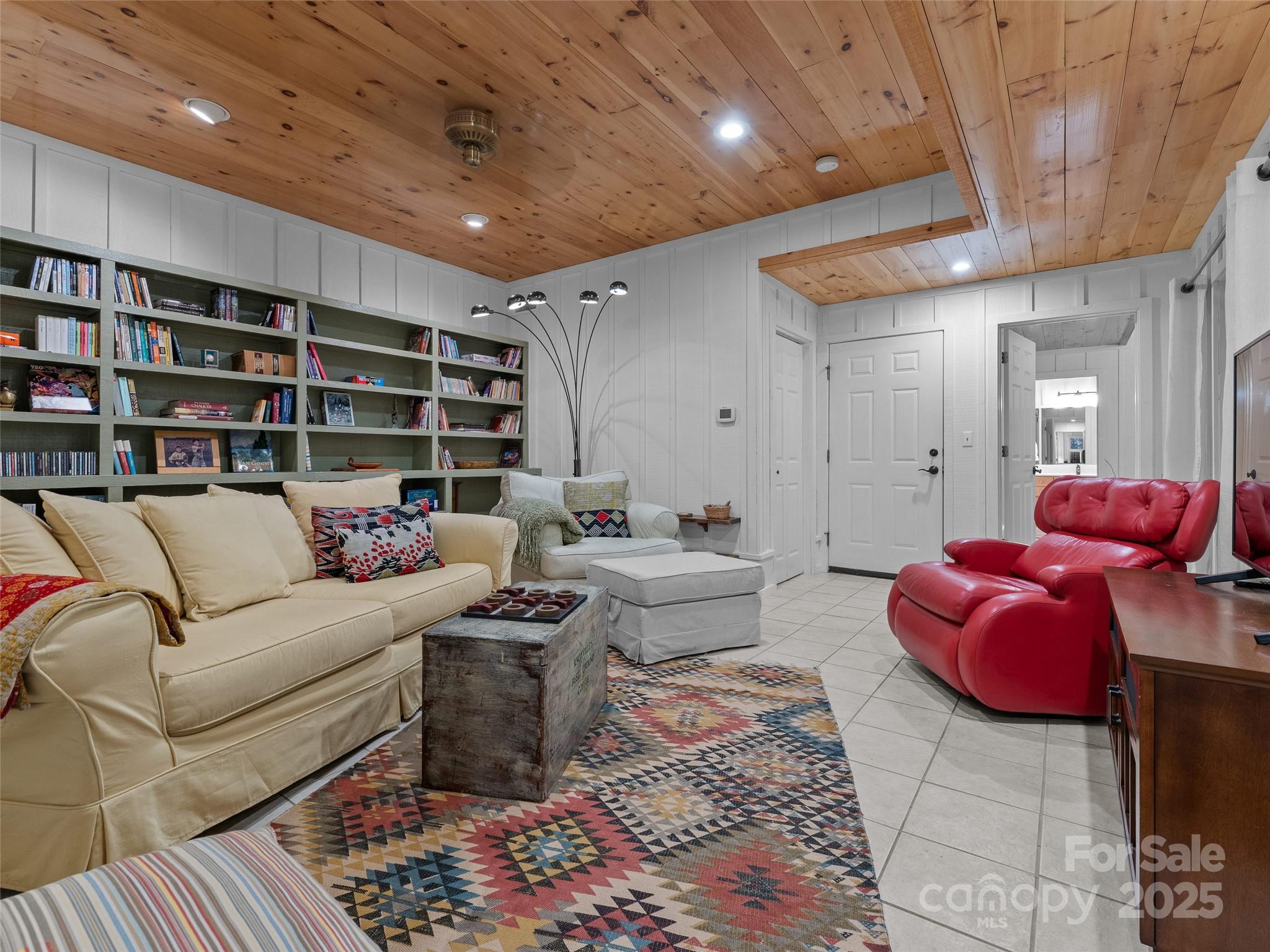 273 David's Trace Pisgah Forest, NC 28768 - Photo 35 of 48 a living room with furniture and a book shelf