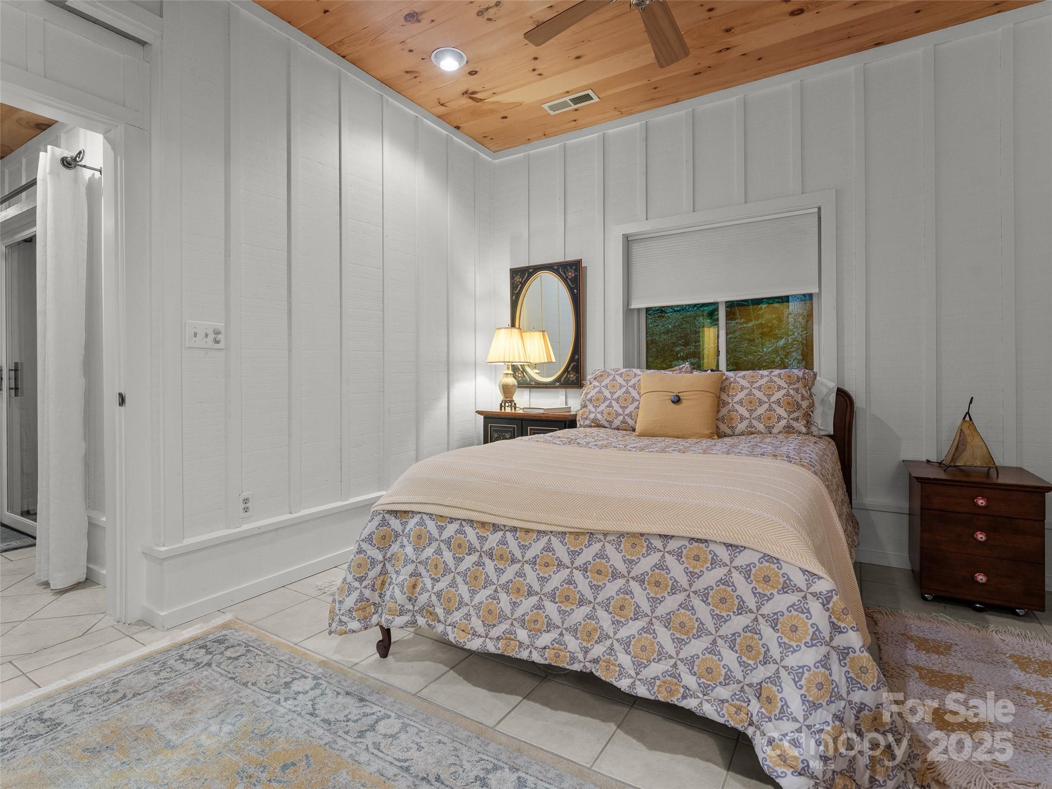 273 David's Trace Pisgah Forest, NC 28768 - Photo 39 of 48 a bedroom with a bed and a window