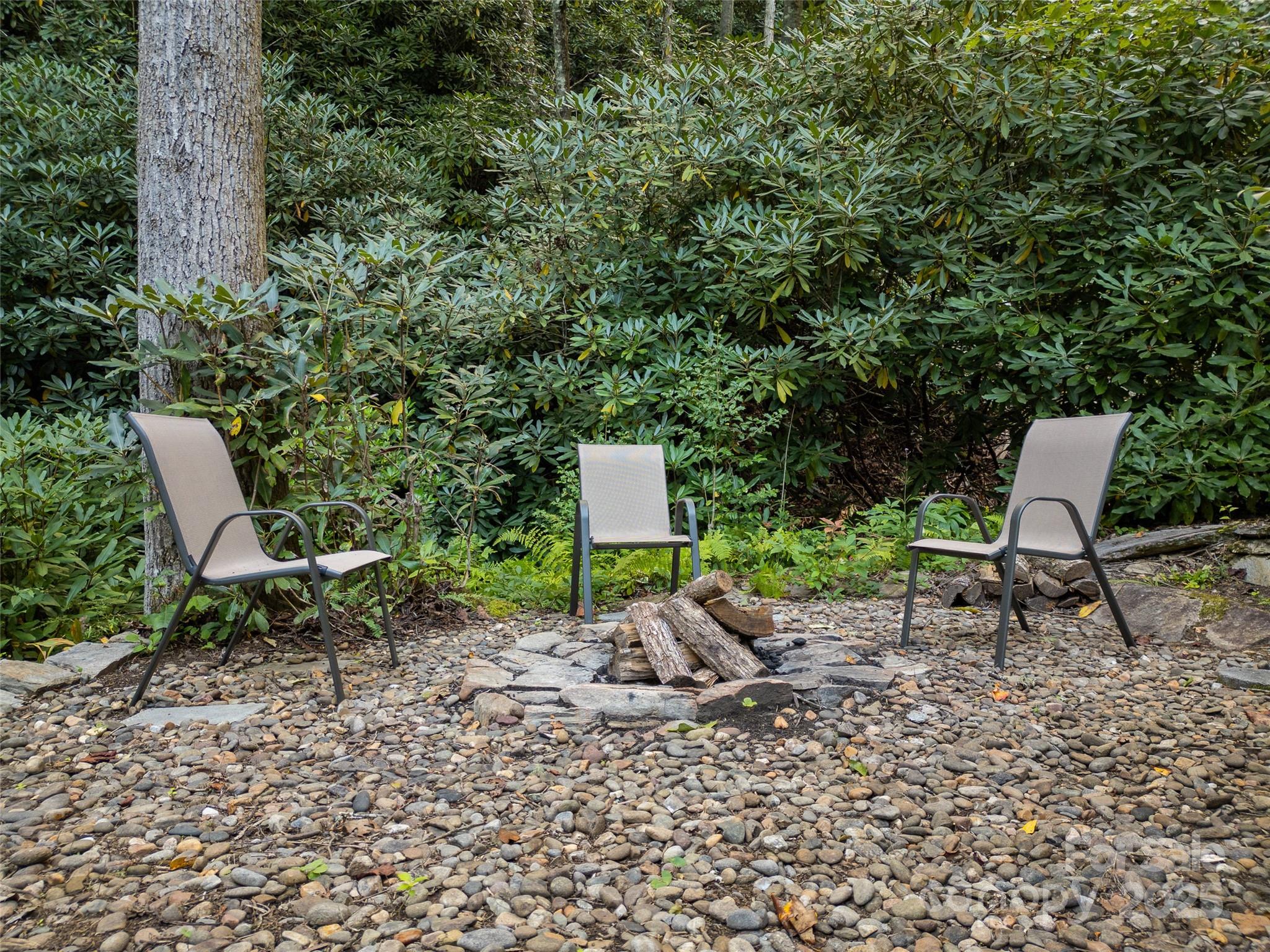 273 David's Trace Pisgah Forest, NC 28768 - Photo 45 of 48 a backyard of a house with table and chairs