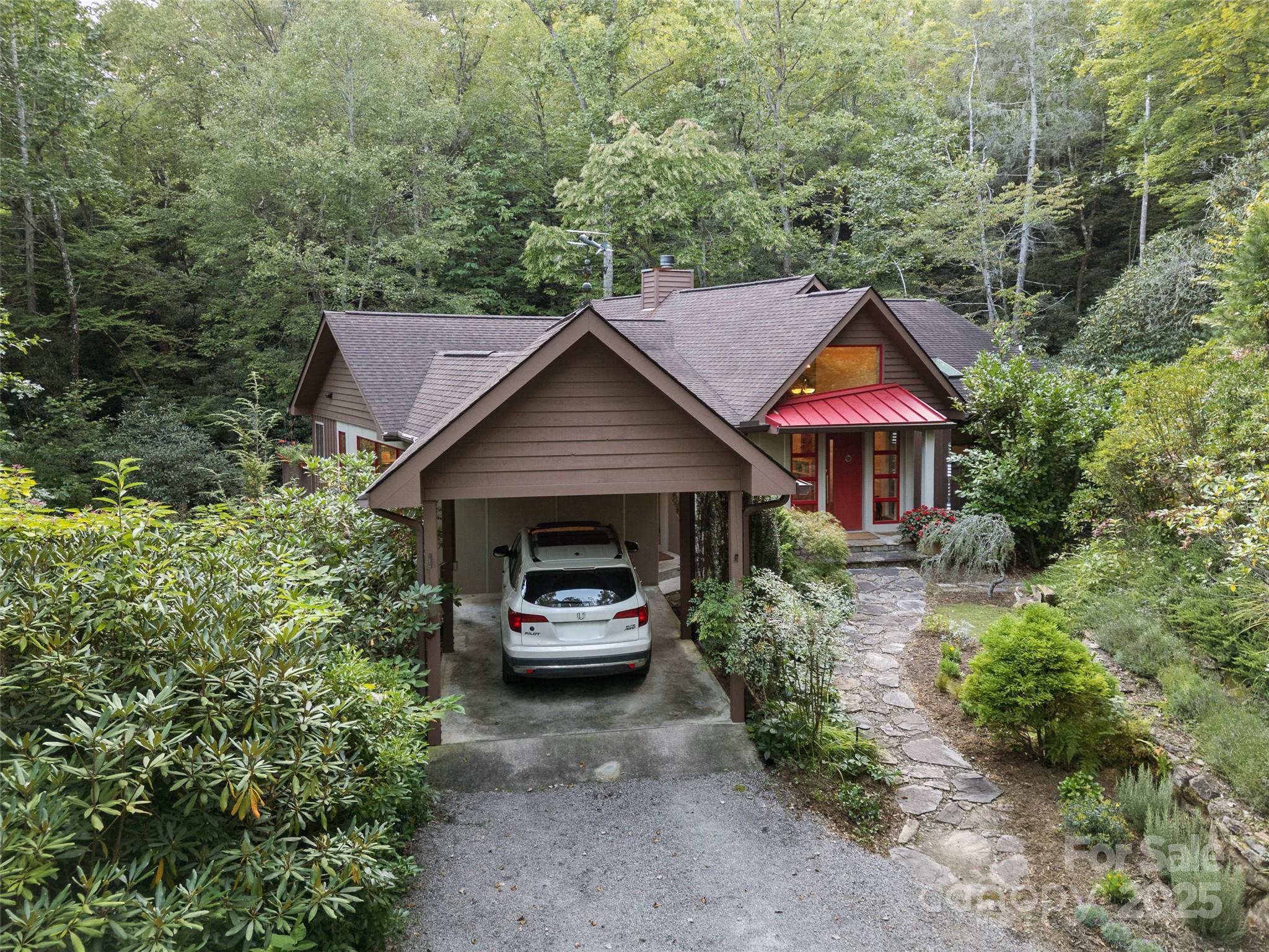 273 David's Trace Pisgah Forest, NC 28768 - Photo 6 of 48 a view of house with trees in the background