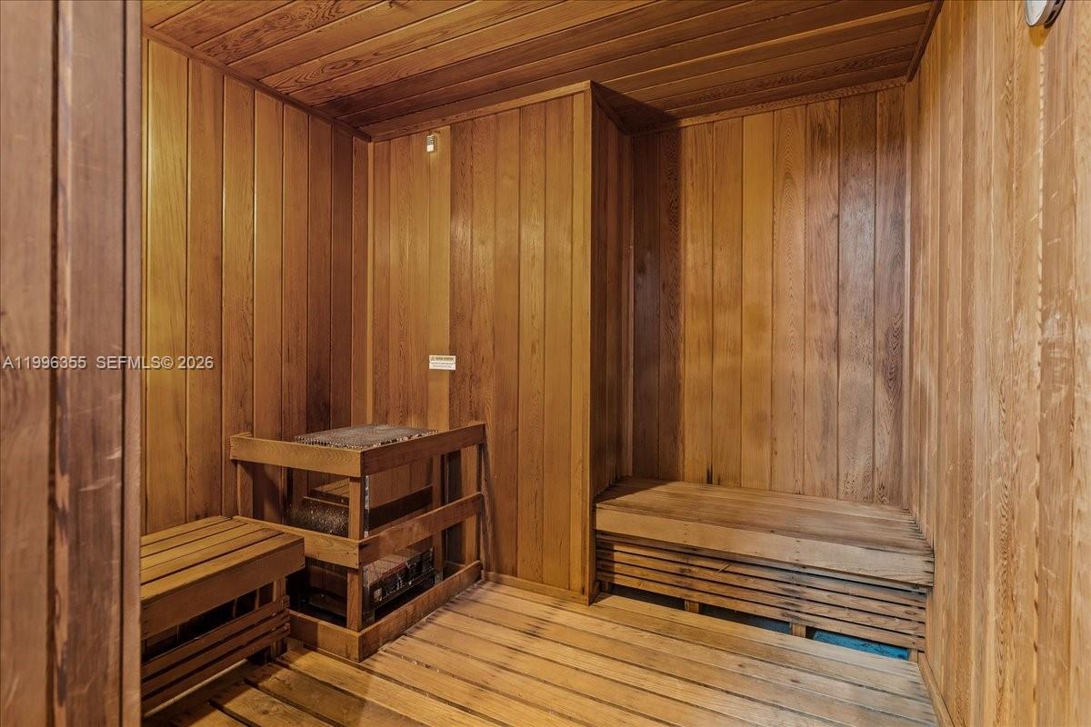 151 Southeast 1st Street, Unit 3107 Miami, FL 33131 - Photo 19 of 30 a view of a balcony with chairs and wooden floor