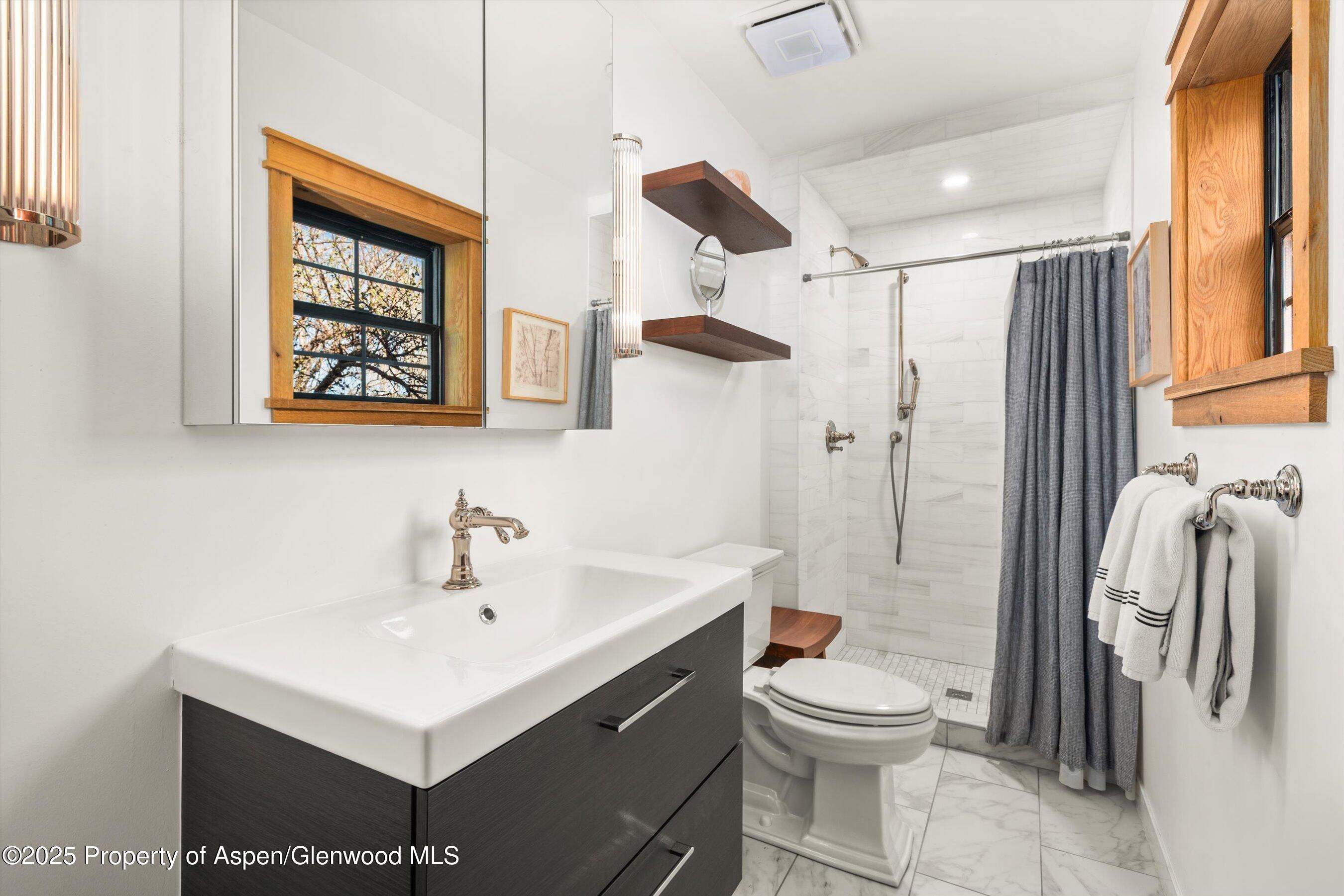 113 Crossland Drive Basalt, CO 81621 - Photo 12 of 28 a bathroom with a sink toilet and shower