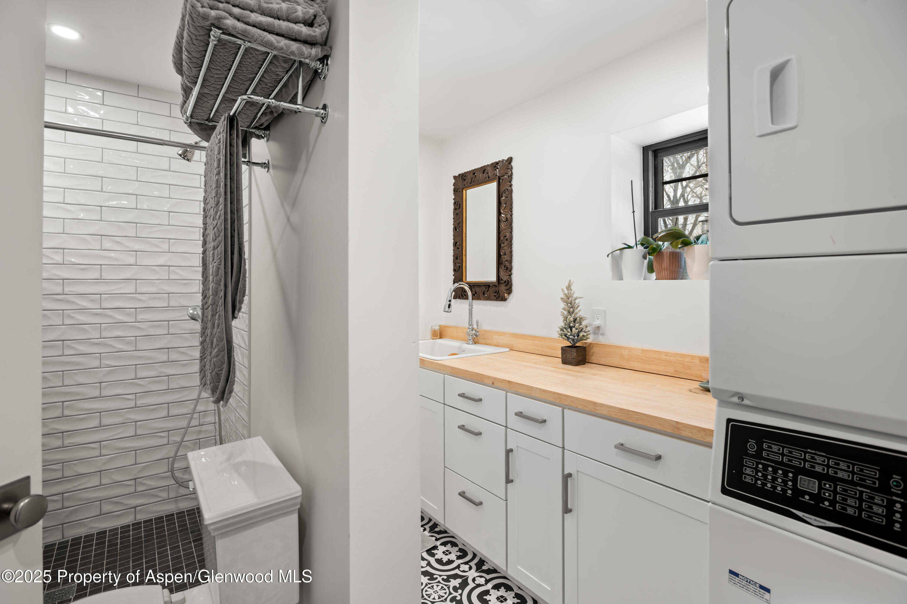 113 Crossland Drive Basalt, CO 81621 - Photo 17 of 28 a bathroom with a sink a mirror and shower