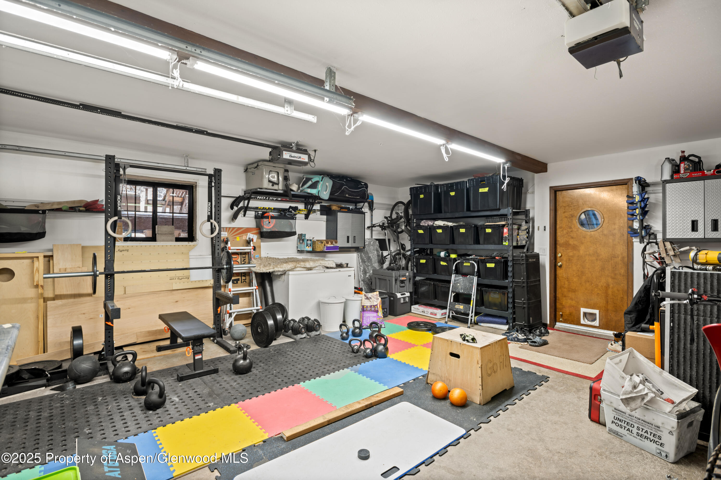 113 Crossland Drive Basalt, CO 81621 - Photo 20 of 28 a room with gym equipment and view of kitchen
