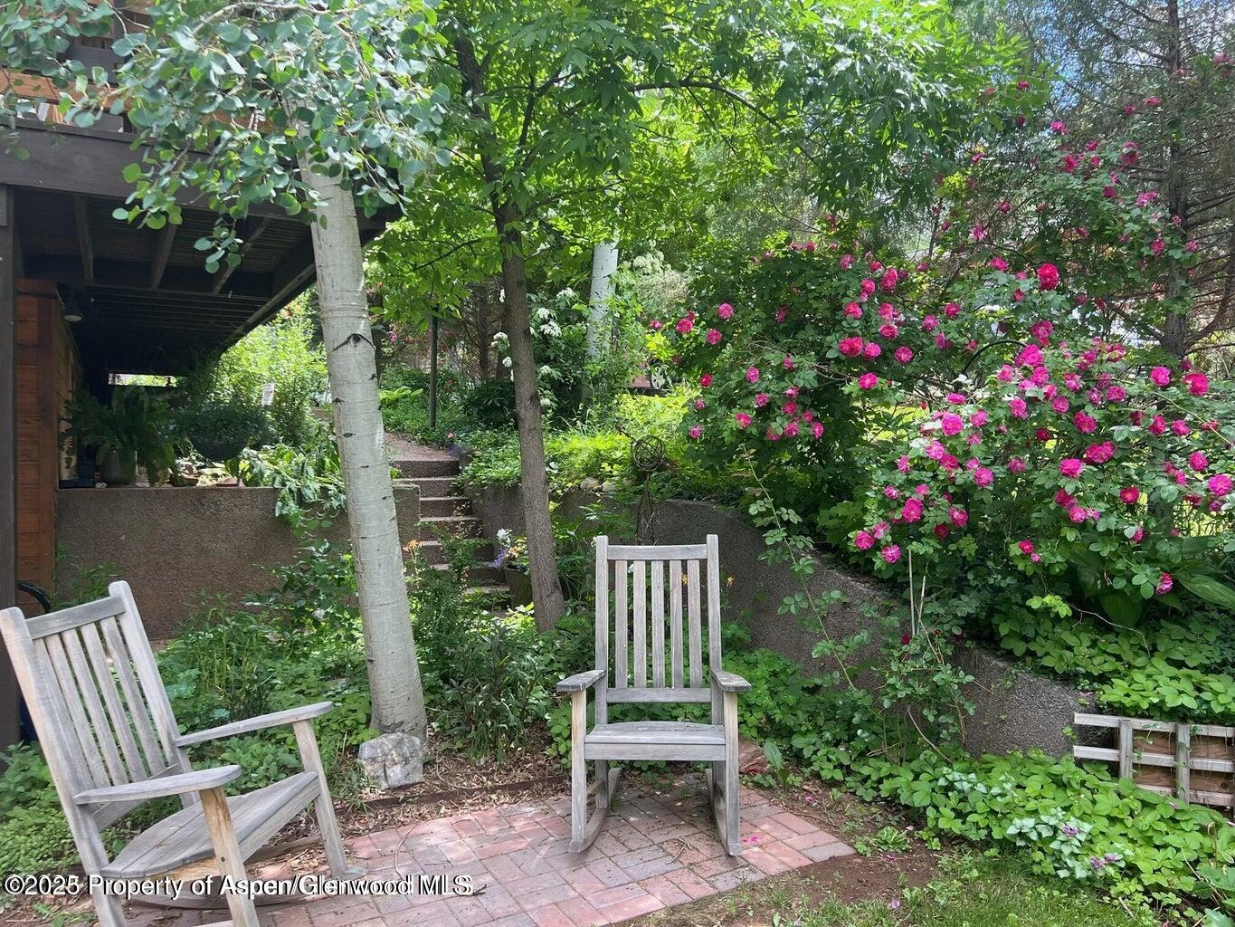113 Crossland Drive Basalt, CO 81621 - Photo 21 of 28 a wooden bench sitting in backside of a house