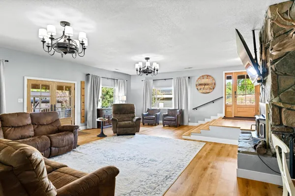 a bathroom with a granite countertop toilet sink and mirror