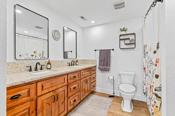 a backyard of a house with table and chairs