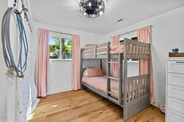 a view of a chair and table in the garden