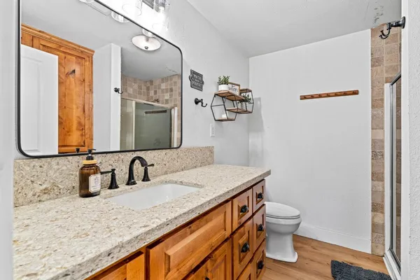 a view of a patio with table and chairs