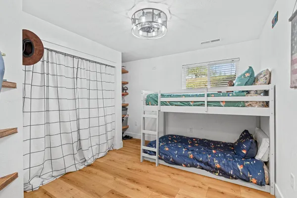 a view of porch with a table and chairs