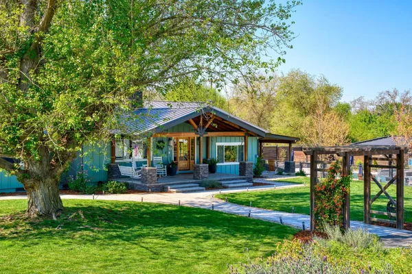 a front view of a house with a yard
