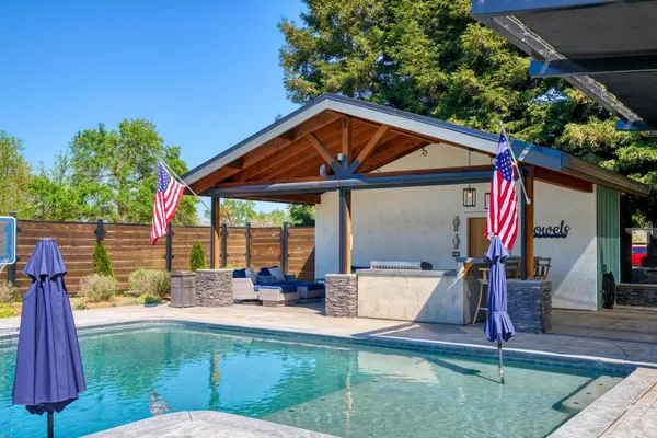 a view of a car park in front of house