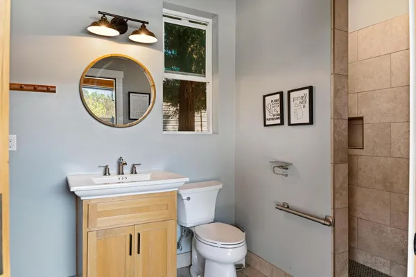 a backyard of a house with barbeque oven