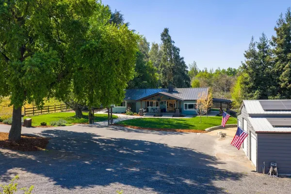 a house with trees in the background