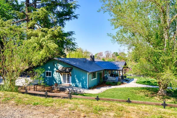 a view of a yard with an ocean view