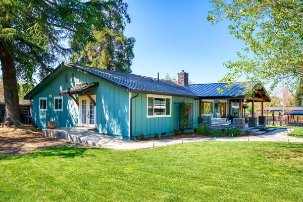 a view of a lake with a house in the background