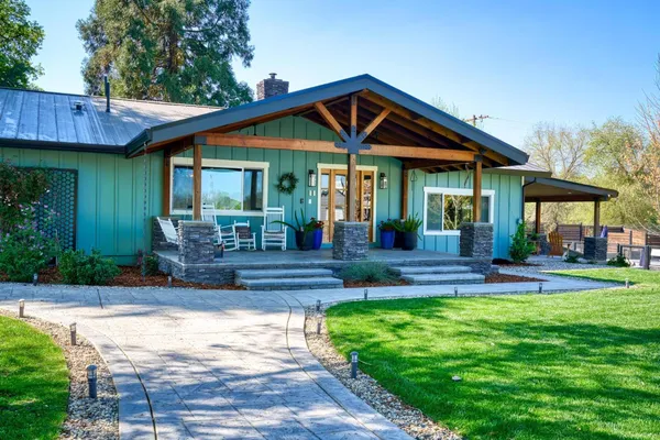 a potted plant sitting in front of a house