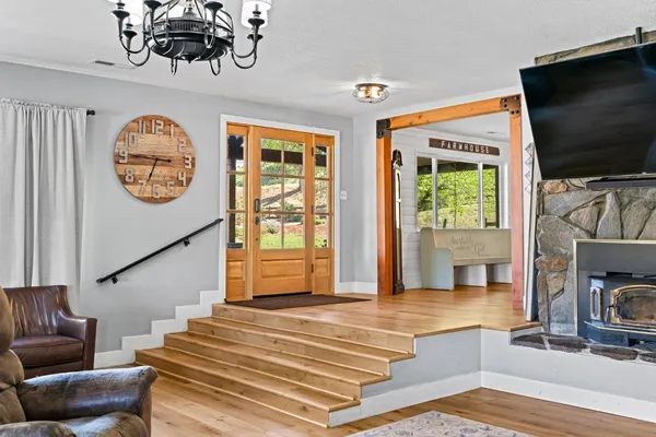 a kitchen with stainless steel appliances granite countertop wooden cabinets a sink and a stove